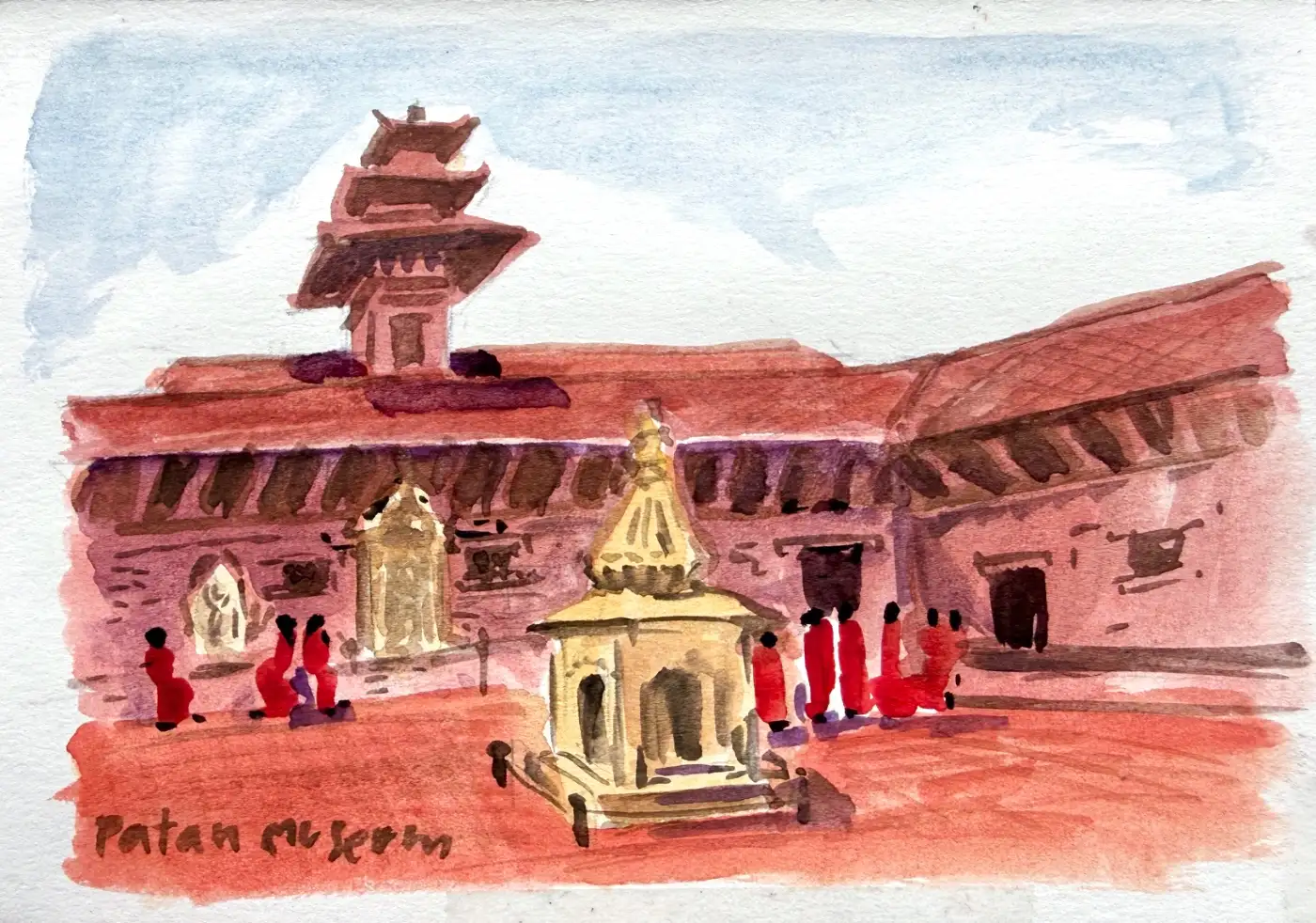 The museum's red brick front, a three-tier pagoda roof rising behind it, a small gold shrine in the middle of the square and a knot of figures in red beside it