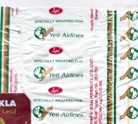 A strip of sweet wrappers, specially wrapped for Yeti Airlines printed over and over