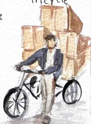 A cargo tricycle stacked far above the rider's head with brown boxes, the rider leaning into the pedals