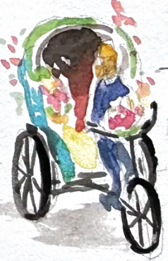 A tricycle taxi painted all over in flowers and colour, a passenger tucked into the back